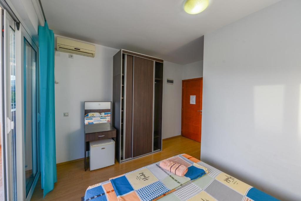 Postel nebo postele na pokoji v ubytování Rexha Apartments