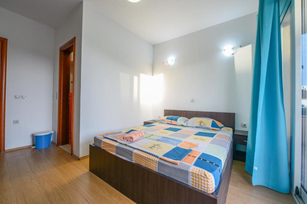 Postel nebo postele na pokoji v ubytování Rexha Apartments