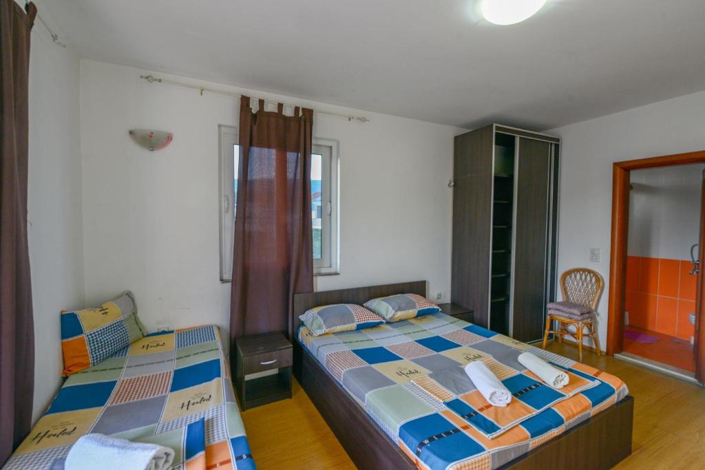 Postel nebo postele na pokoji v ubytování Rexha Apartments
