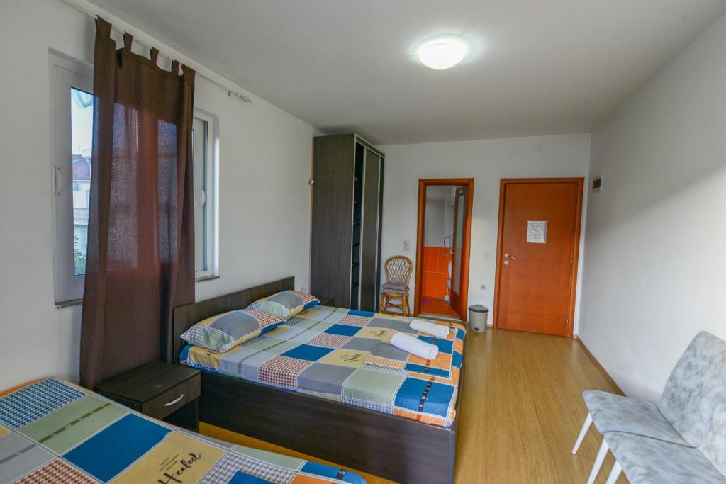 Postel nebo postele na pokoji v ubytování Rexha Apartments