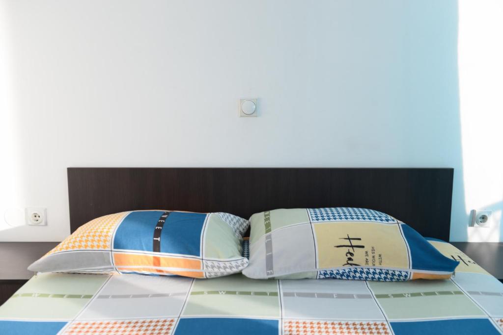 Postel nebo postele na pokoji v ubytování Rexha Apartments