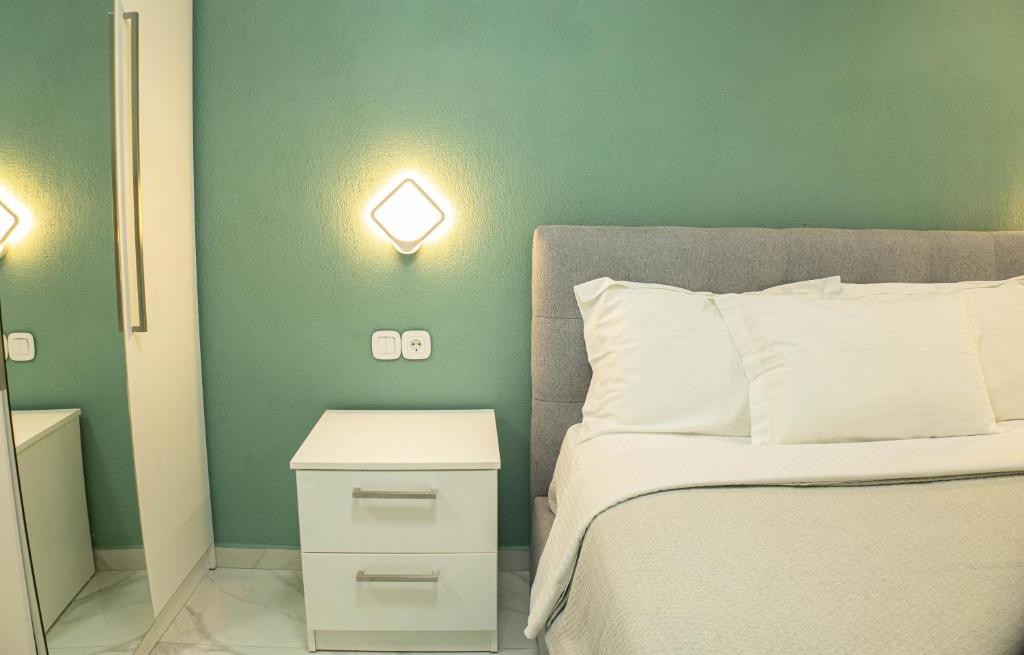 Postel nebo postele na pokoji v ubytování Mourati House