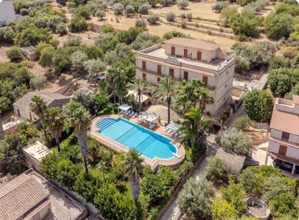 an aerial view of a house with a swimming pool at ALTA lux homeholiday stone in Modica