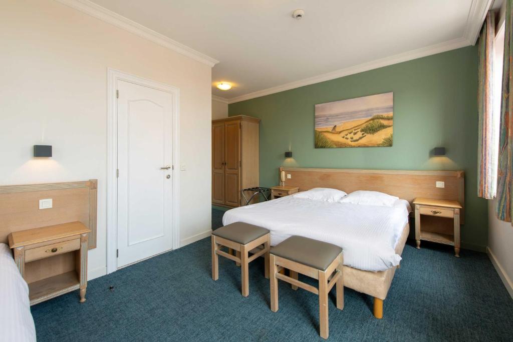 Postel nebo postele na pokoji v ubytování Hotel Sabot D'Or