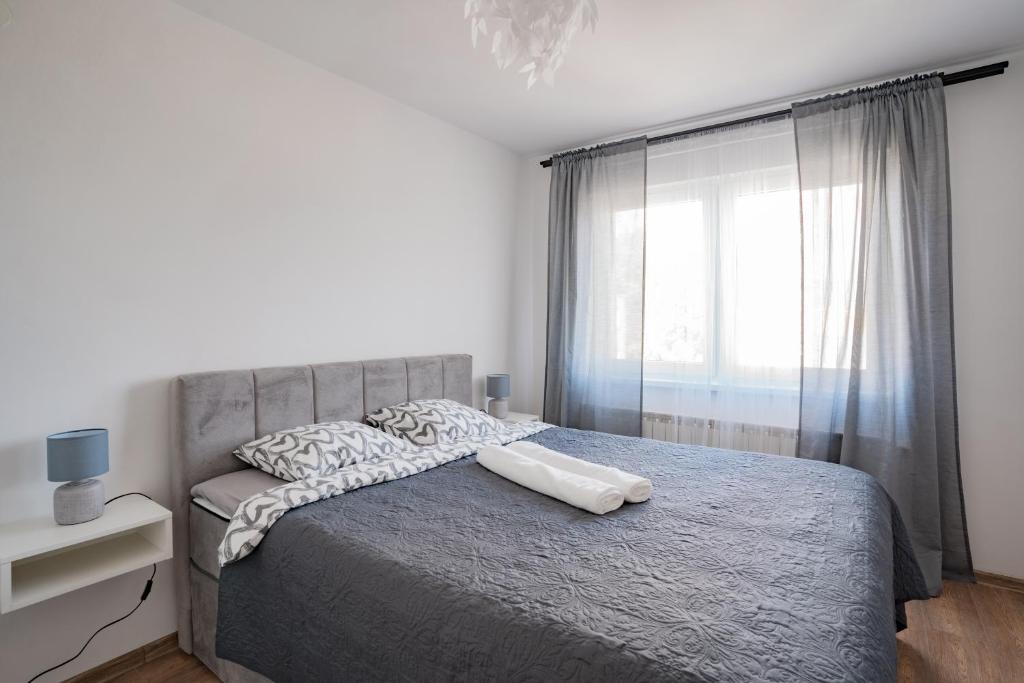 Postel nebo postele na pokoji v ubytování Apartman Sanda