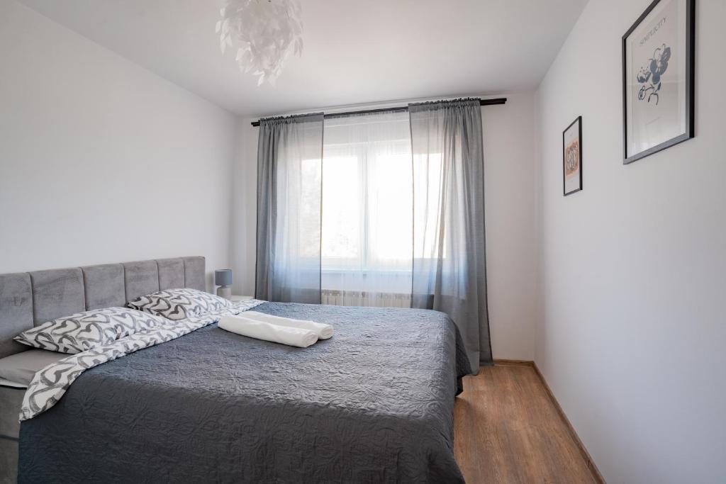 Postel nebo postele na pokoji v ubytování Apartman Sanda