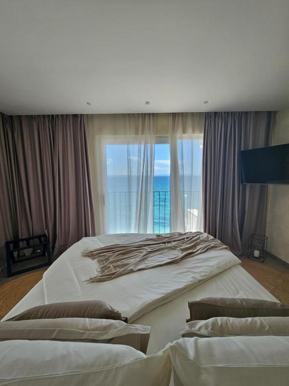 Postel nebo postele na pokoji v ubytování Hotel Aria