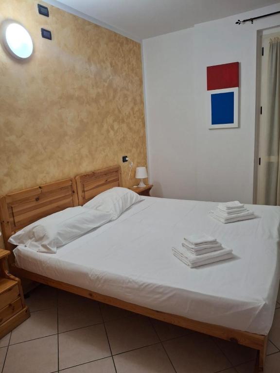 Postel nebo postele na pokoji v ubytování Albergo quatro pini