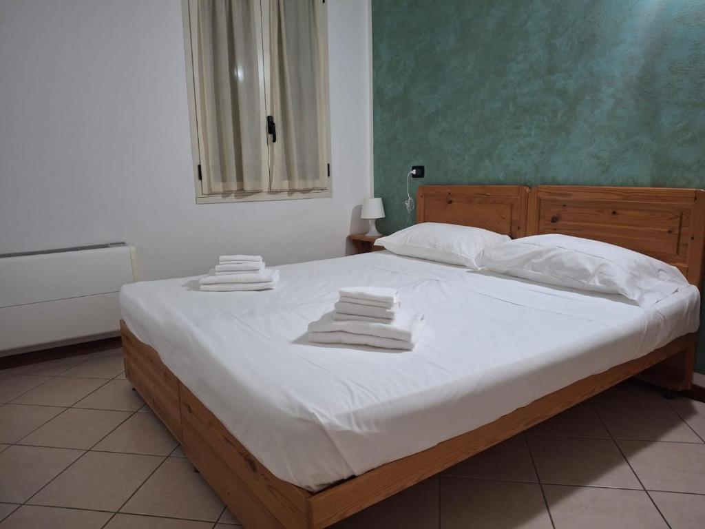 Postel nebo postele na pokoji v ubytování Albergo quatro pini