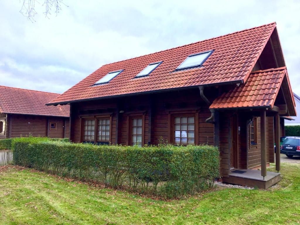 a house with a roof with skylights on it at Blockhaus James Cook - Meerblick in Sassnitz