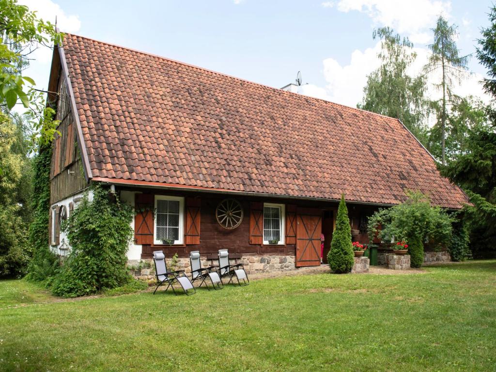 a house with chairs in front of it at Holiday Home Perła by Interhome in Trygort