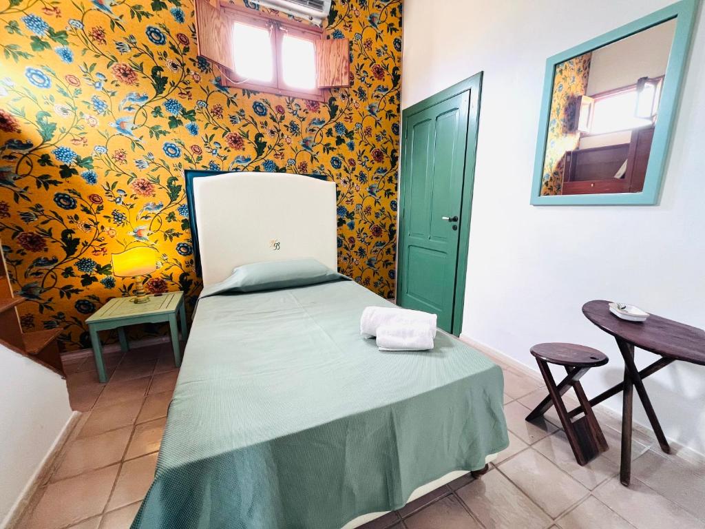 Postel nebo postele na pokoji v ubytování Baglio Fontanasalsa
