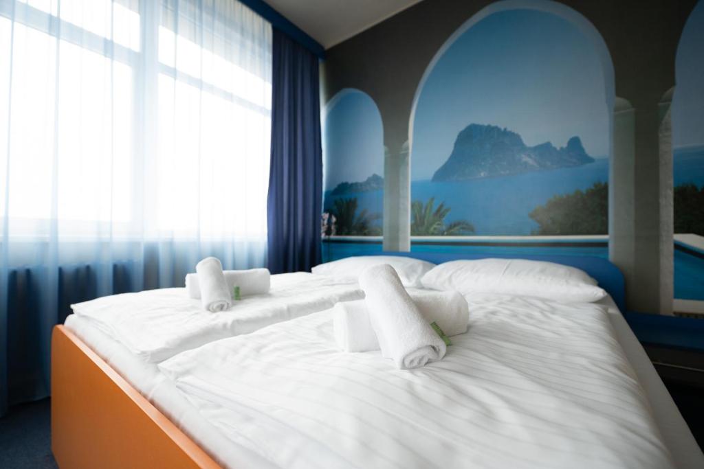 Posteľ alebo postele v izbe v ubytovaní Hotel Liberec