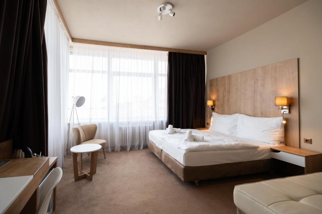 Posteľ alebo postele v izbe v ubytovaní Hotel Liberec