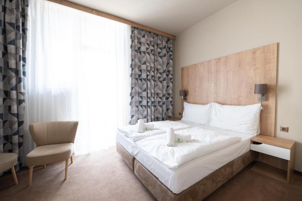 Posteľ alebo postele v izbe v ubytovaní Hotel Liberec