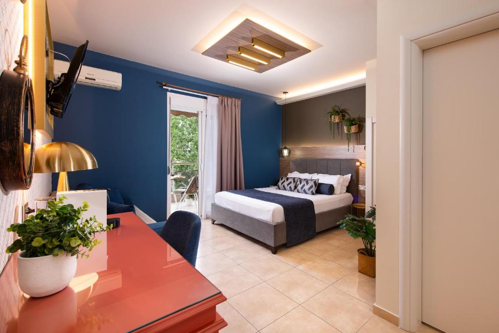Postel nebo postele na pokoji v ubytování ELLE Rooms & Suites