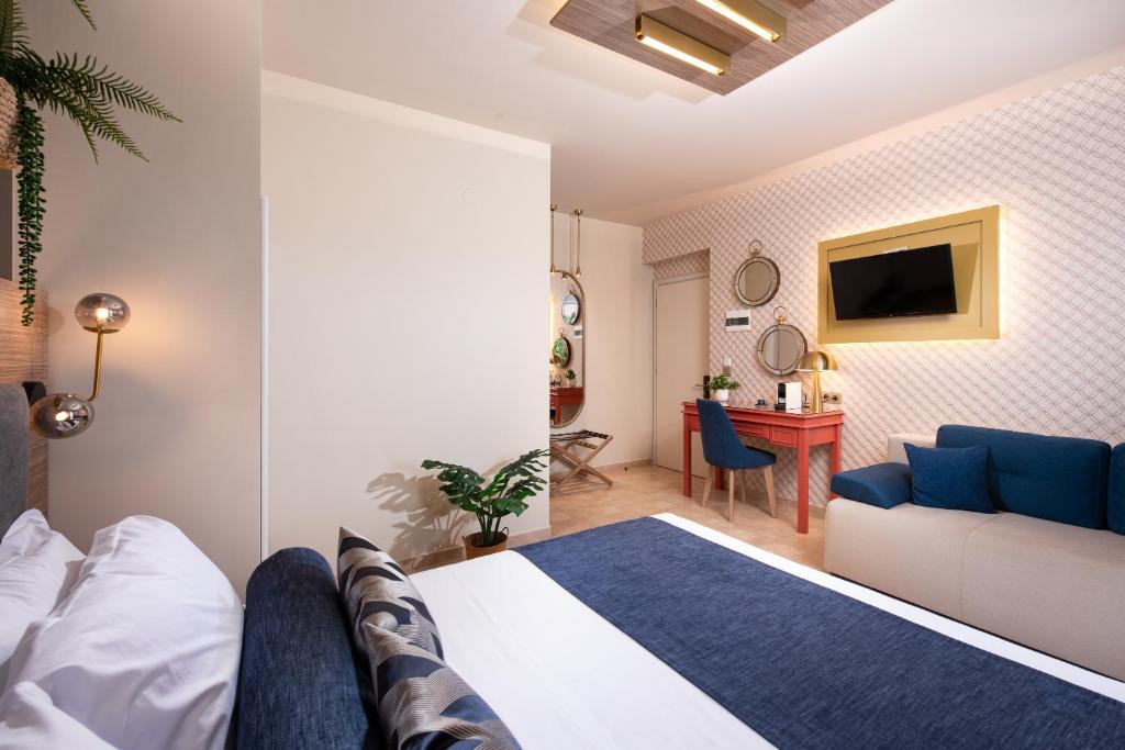 TV a/nebo společenská místnost v ubytování ELLE Rooms & Suites