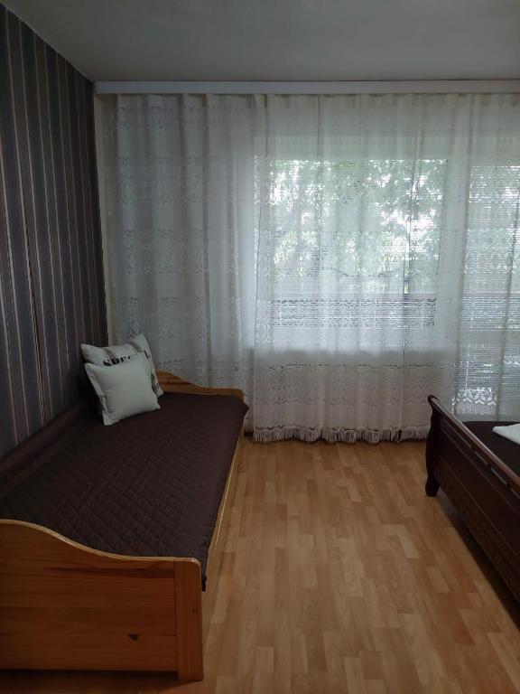 Posteľ alebo postele v izbe v ubytovaní vila Happy
