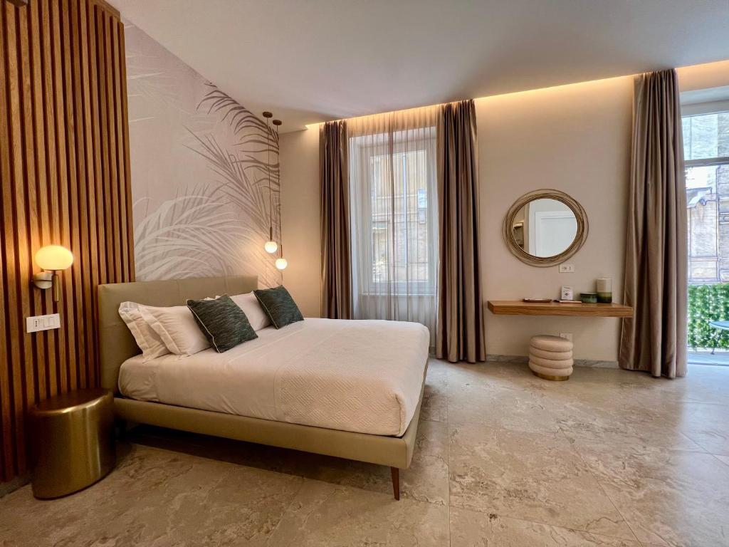 Ένα ή περισσότερα κρεβάτια σε δωμάτιο στο Elegant Rooms