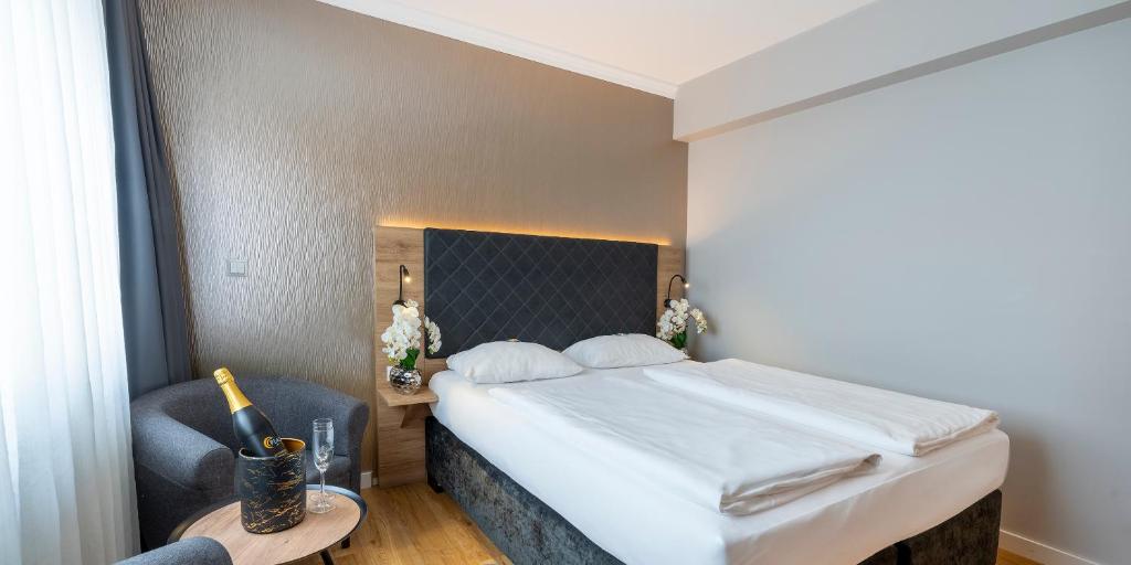 Katil atau katil-katil dalam bilik di PLAZA INN Rieker Stuttgart Hauptbahnhof