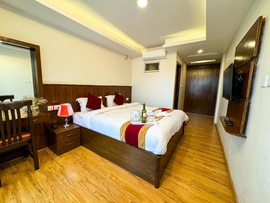 Postel nebo postele na pokoji v ubytování Hotel Abi International