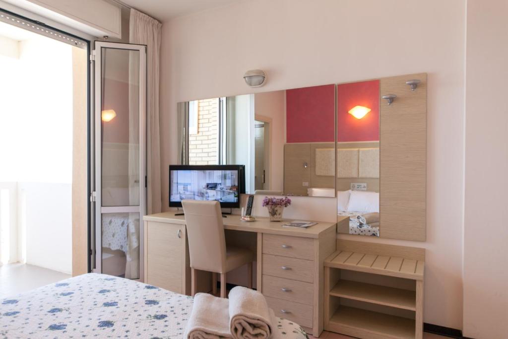 Postel nebo postele na pokoji v ubytování Hotel Napoleon