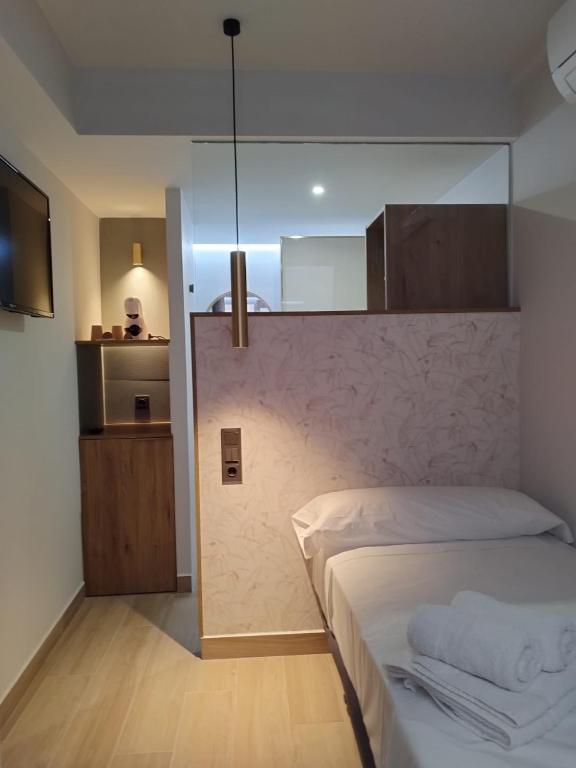 Postel nebo postele na pokoji v ubytování Plaza Rooms