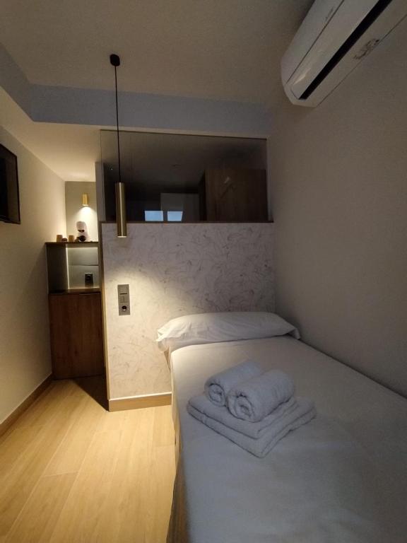 Postel nebo postele na pokoji v ubytování Plaza Rooms