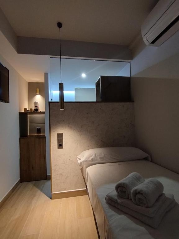 Postel nebo postele na pokoji v ubytování Plaza Rooms