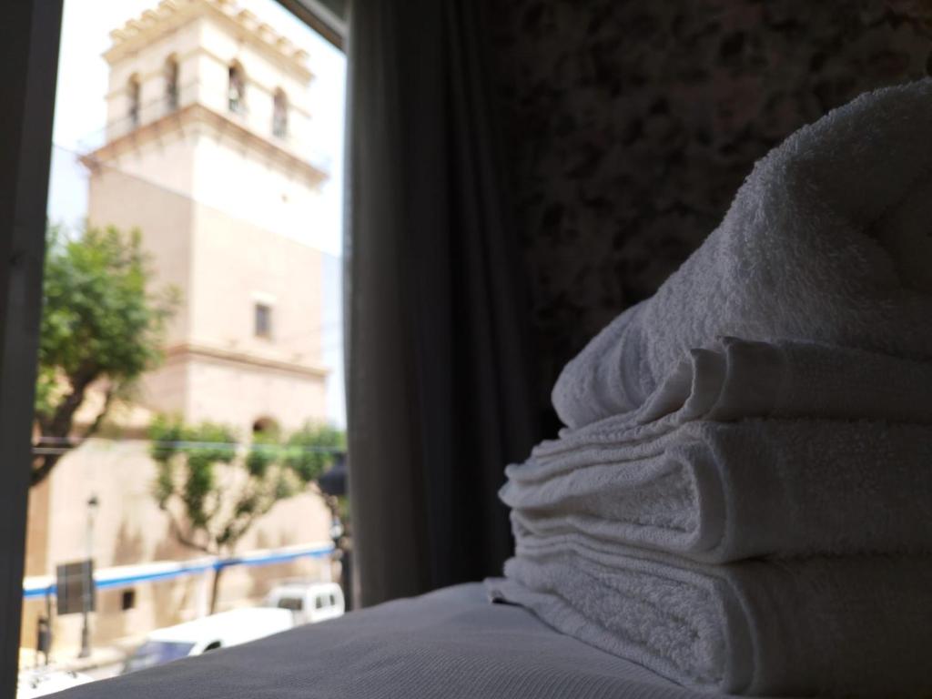Postel nebo postele na pokoji v ubytování Plaza Rooms
