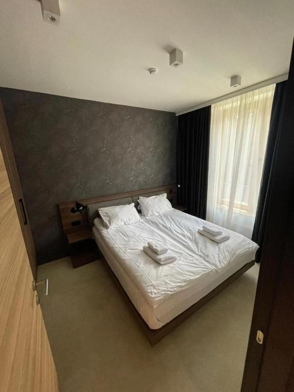 Postel nebo postele na pokoji v ubytování Woodside Apartment