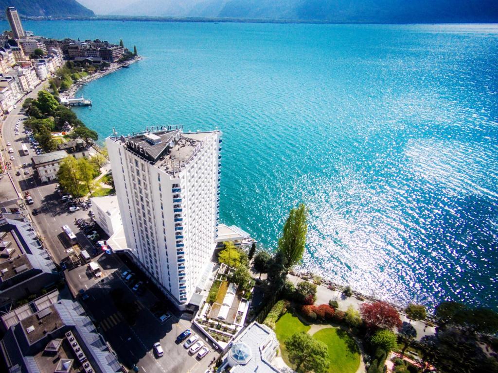 an aerial view of a building next to the water at Hotel Mona Ex-Eurotel in Montreux