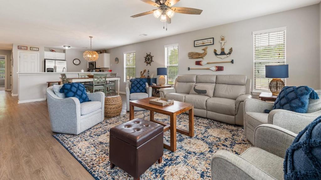 a living room with a couch and a table at 55C Anchors Away II at True Blue condo by Peace Vacations in Pawleys Island