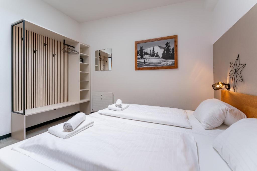Postel nebo postele na pokoji v ubytování Alm Appartements ZellamSee
