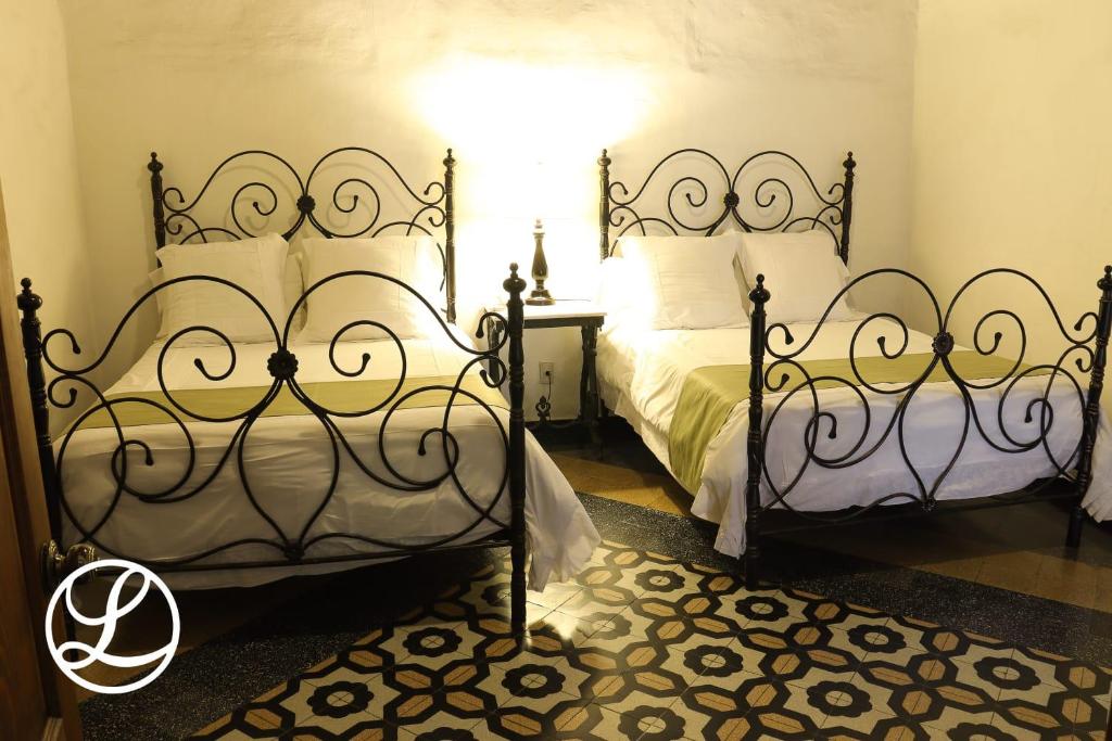 Postel nebo postele na pokoji v ubytování Hotel Layseca