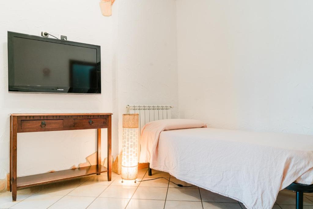 A bed or beds in a room at La Marmora