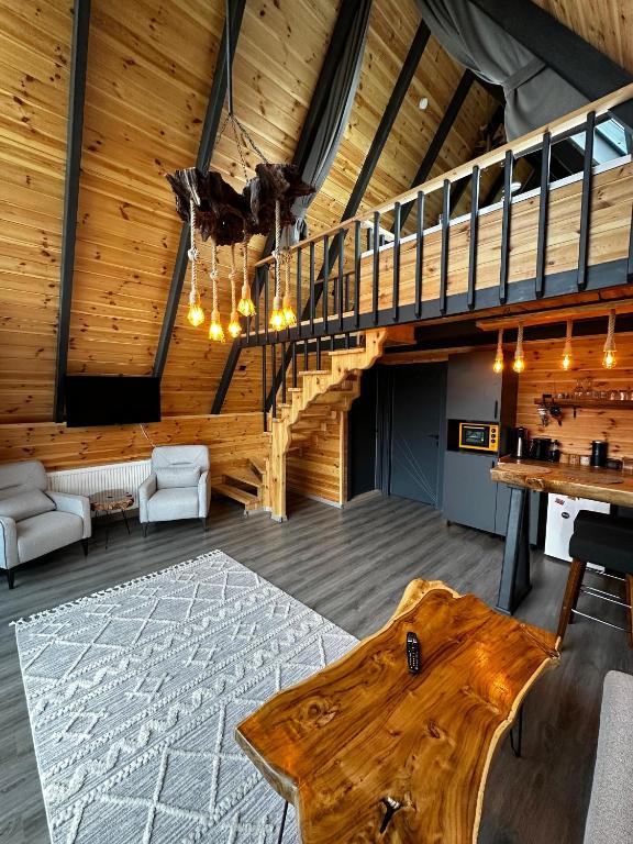 Posezení v ubytování Peleri Suit Bungalow
