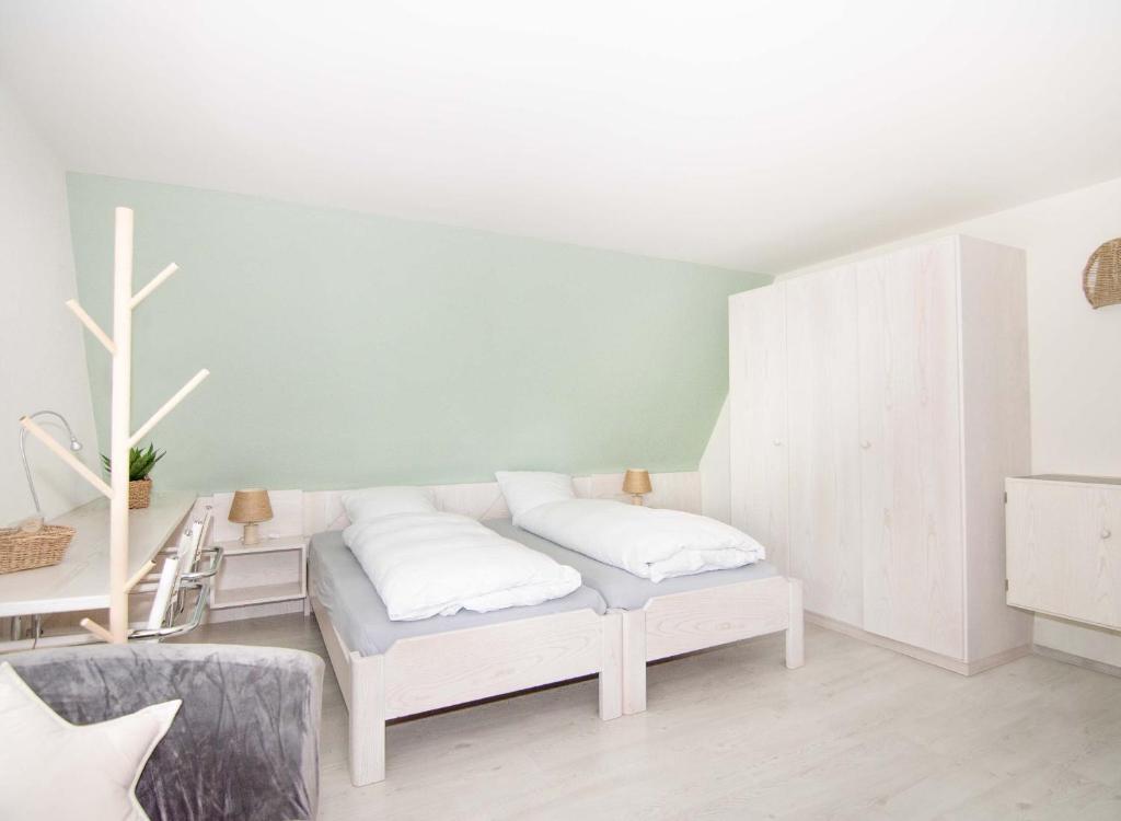 Ένα ή περισσότερα κρεβάτια σε δωμάτιο στο B&B Mont-Crosin