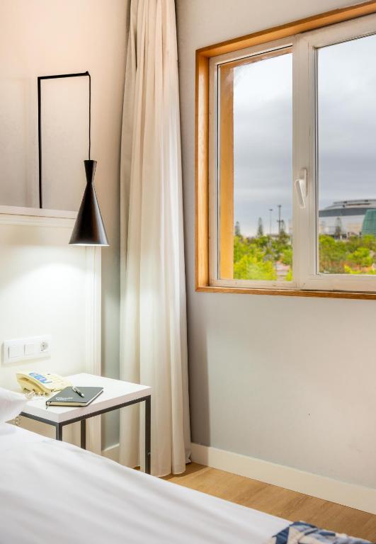 Postel nebo postele na pokoji v ubytování Hotel Beleret