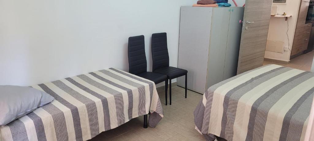 Postel nebo postele na pokoji v ubytování Alghero sun