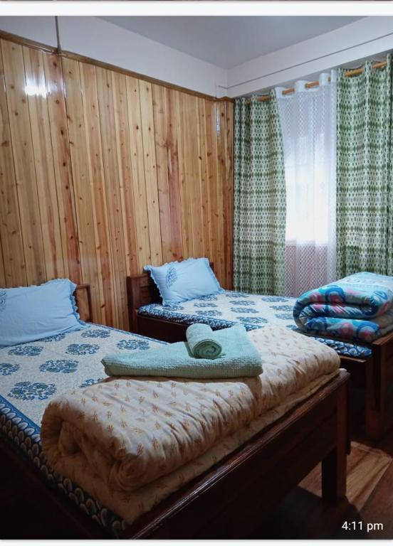 Postel nebo postele na pokoji v ubytování Tigerhill Homestay