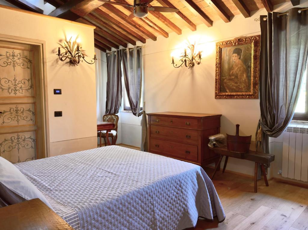 Łóżko lub łóżka w pokoju w obiekcie Relais Santa Margherita