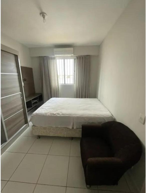 Ένα ή περισσότερα κρεβάτια σε δωμάτιο στο Apartamento Praia