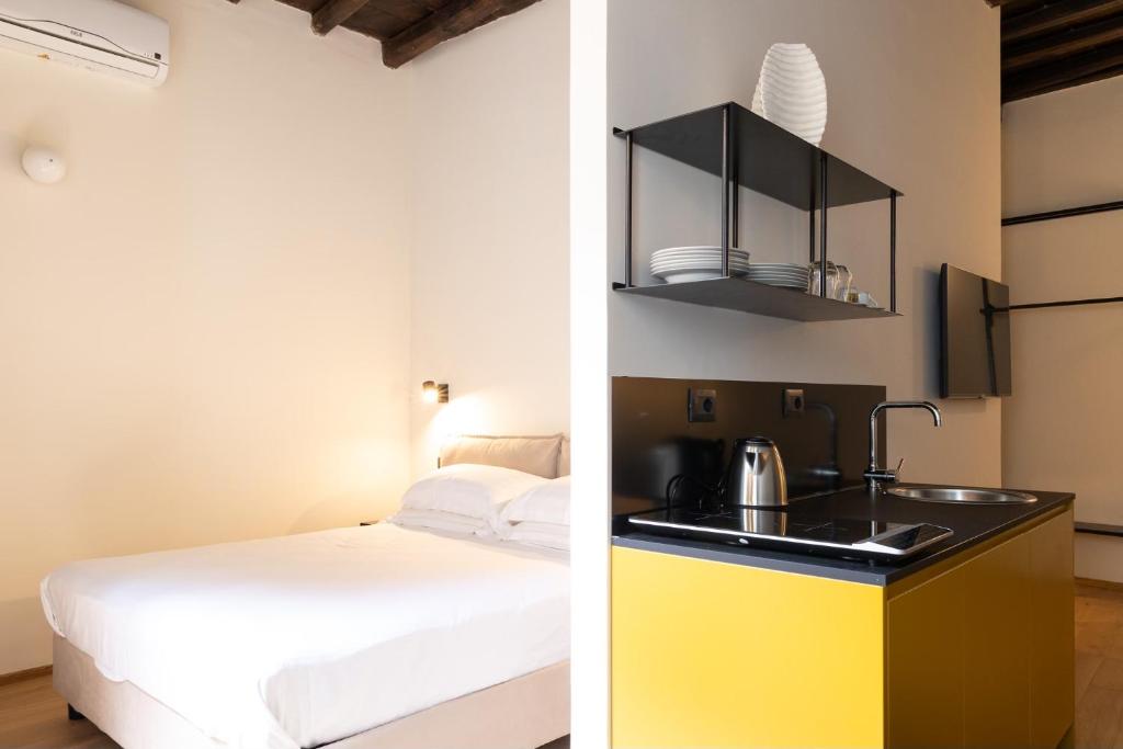 Ένα ή περισσότερα κρεβάτια σε δωμάτιο στο Residenza San Valerio