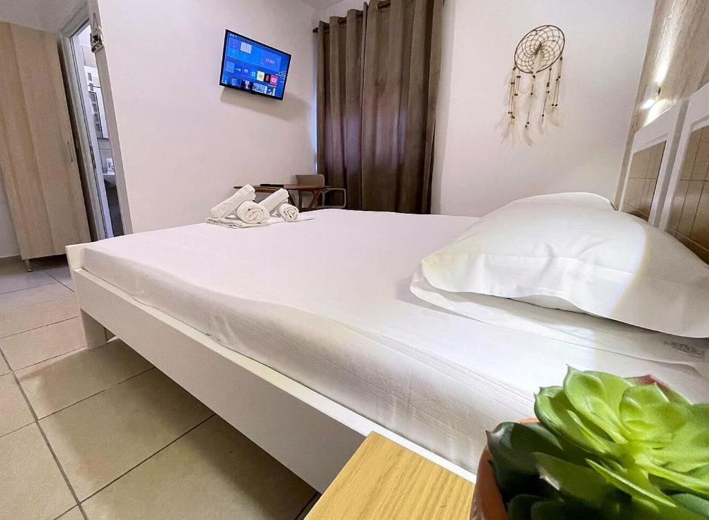 Postel nebo postele na pokoji v ubytování Harmony Central