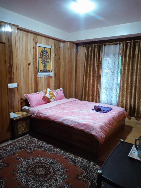 Postel nebo postele na pokoji v ubytování Tigerhill Homestay