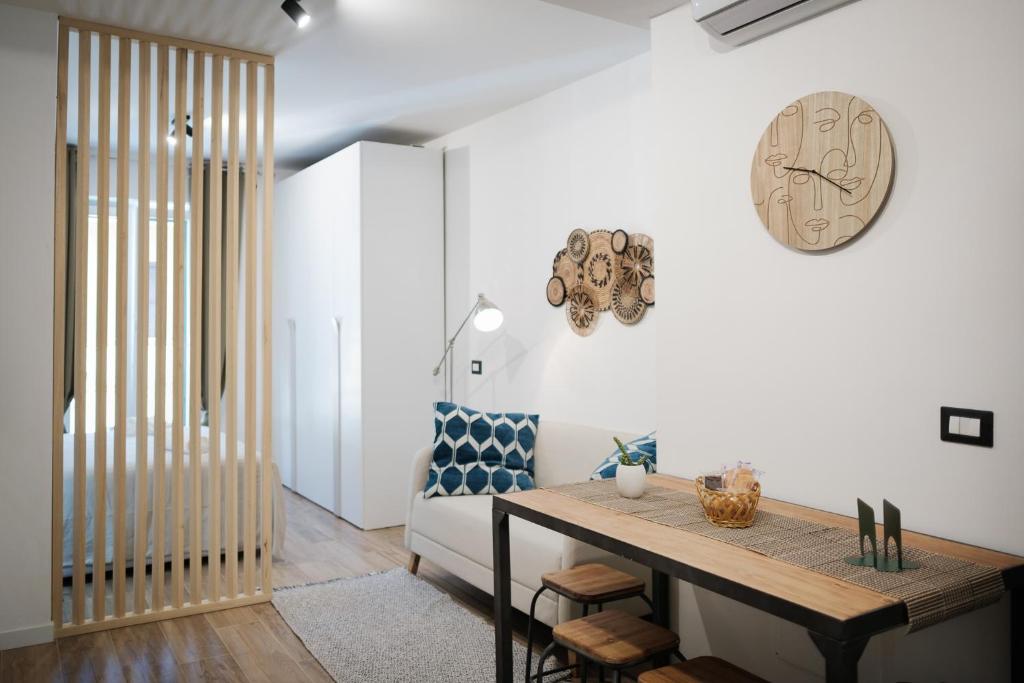 a living room with a table and a couch at Mamma Maria PT in Monterotondo