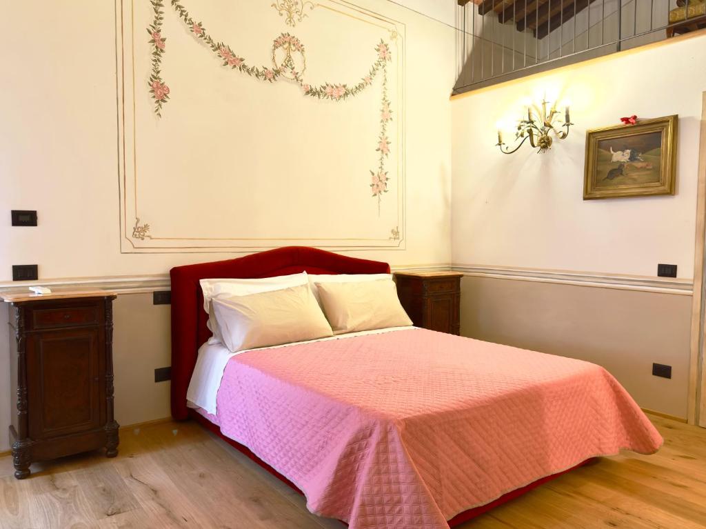 Łóżko lub łóżka w pokoju w obiekcie Relais Santa Margherita