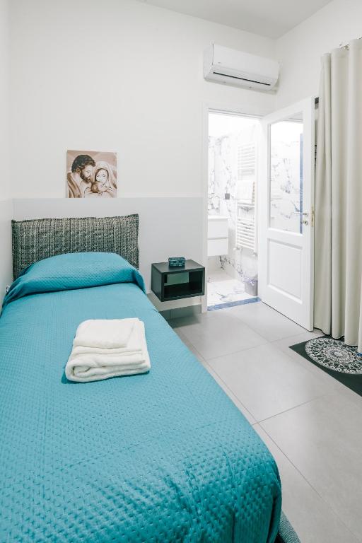 Postel nebo postele na pokoji v ubytování B&B Insonnyroom