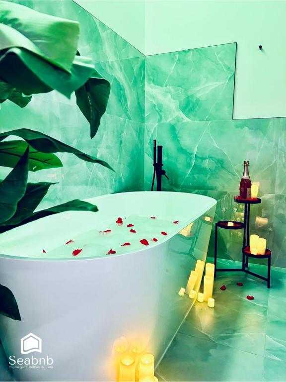 a bathroom with a bath tub with a fish mural at Seabnb - City & Sea - AC - 2 Min to Tram in Nice